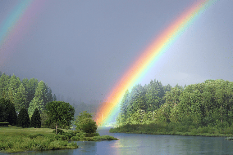 Travel for a pleasant weather with rainbow